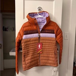 Cotopaxi Women’s Fuego Down Hooded Jacket
New with tags!
Size X-Small